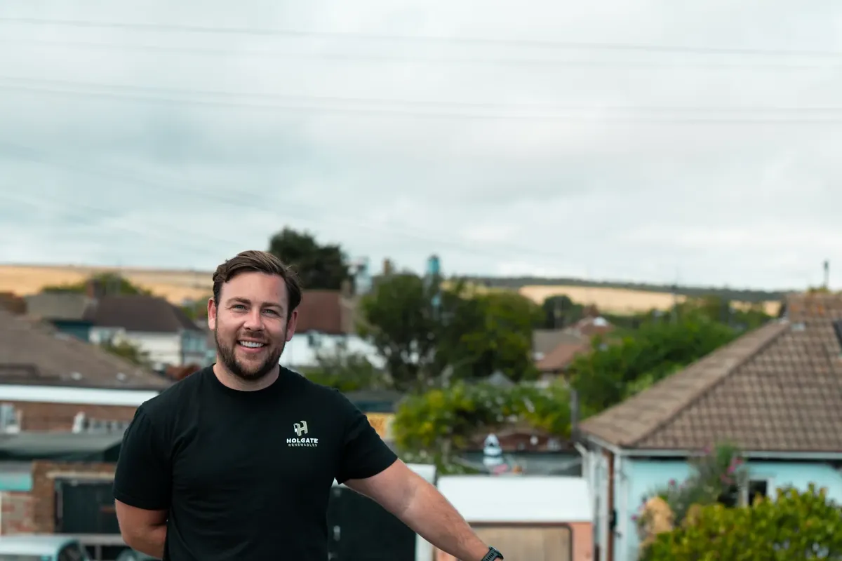 Dan from Holgate Renewables next to the company van